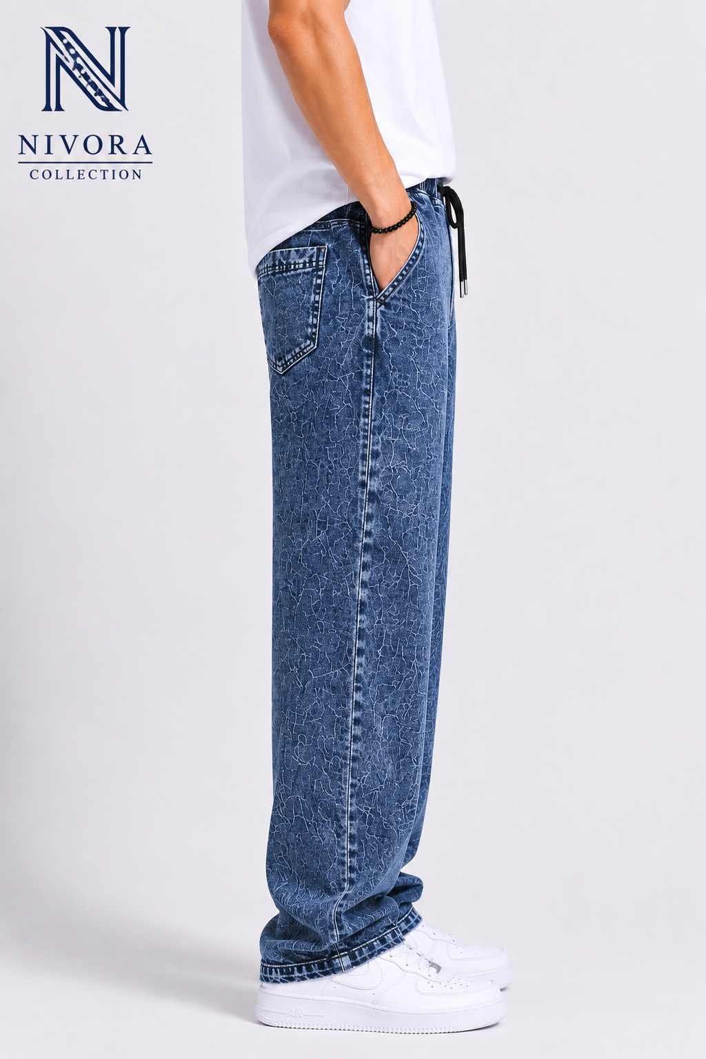 Side profile of loose stone washed dark blue stretchable denim jeans for men by Nivora Jeans Collections
